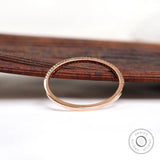 Interior and underside view of pave half eternity band in solid gold