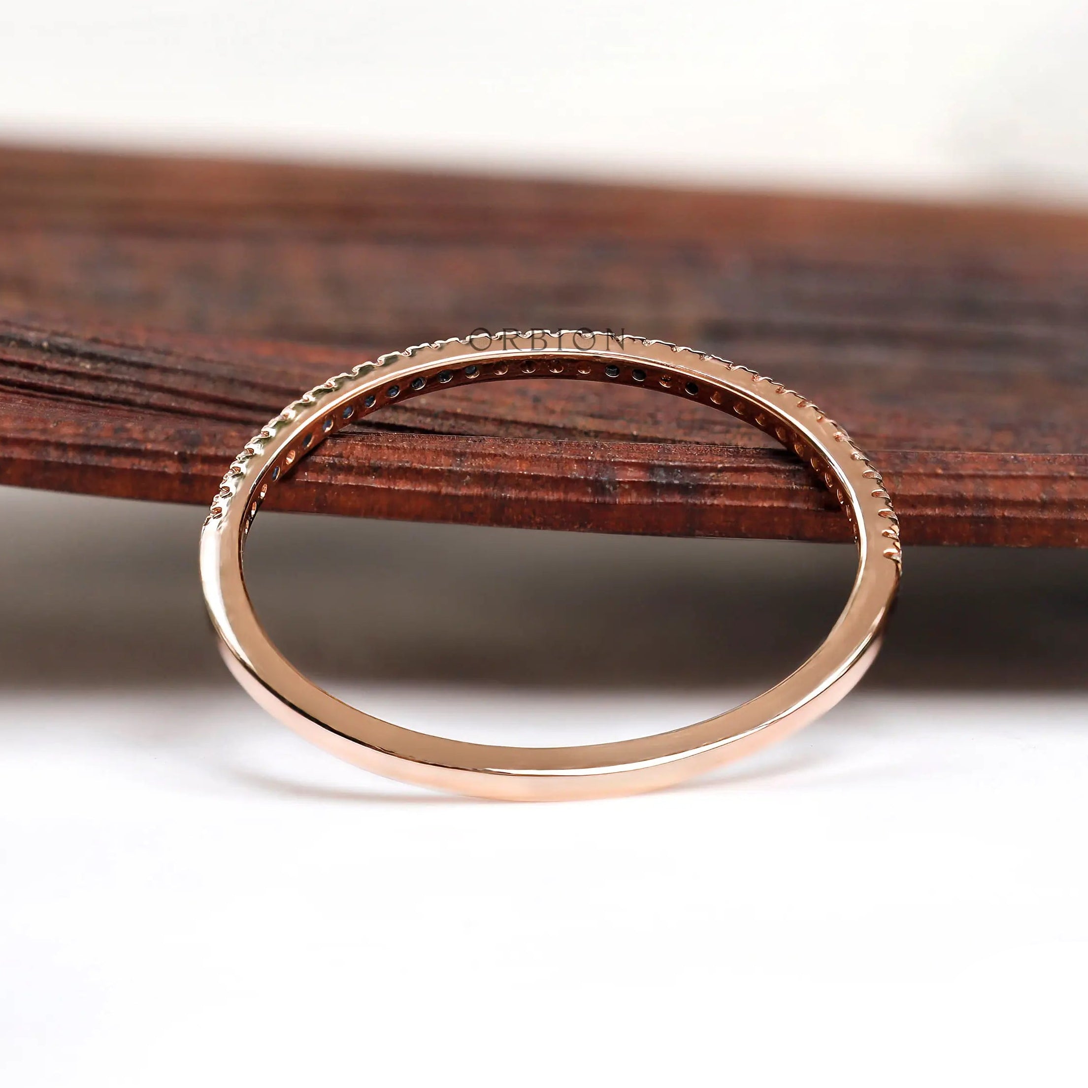 Interior and underside view of pave half eternity band in solid gold