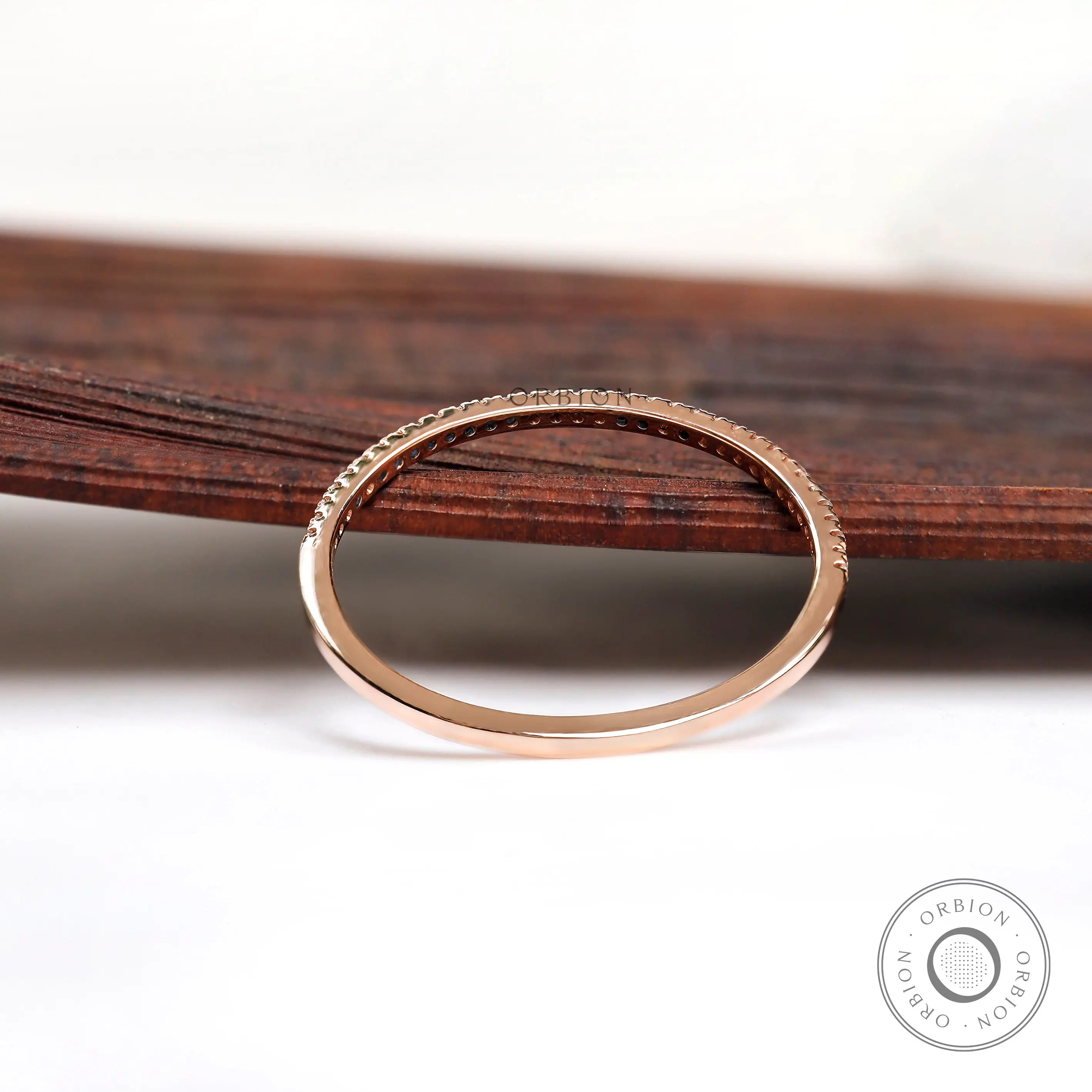 Interior and underside view of pave half eternity band in solid gold