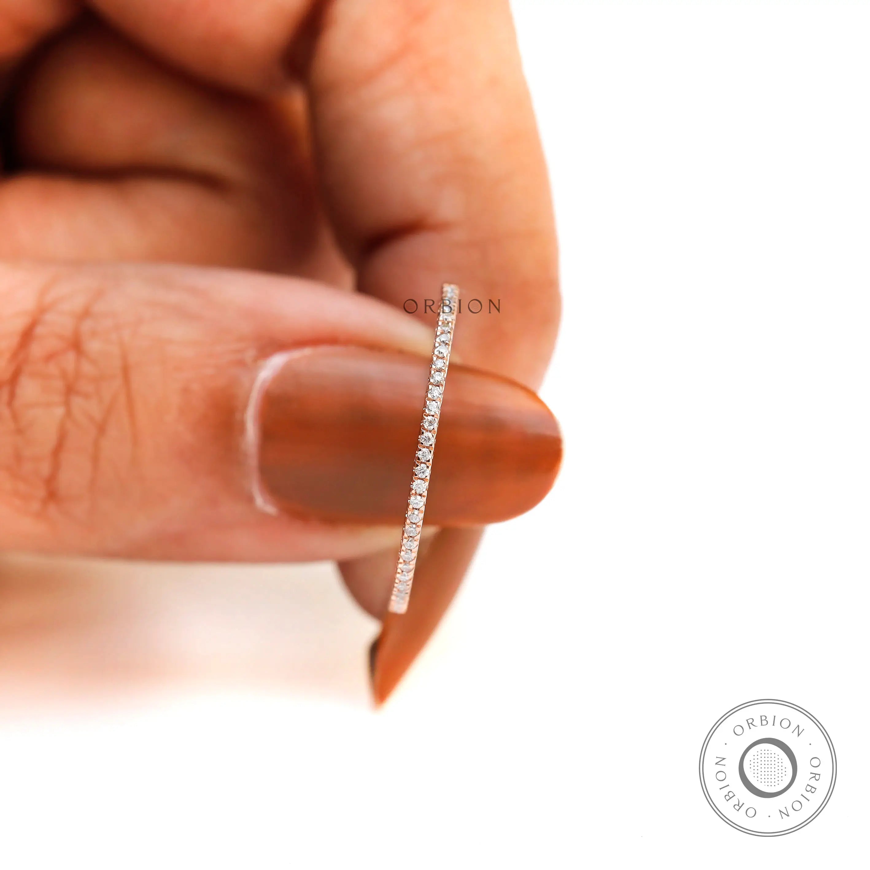 Close-up of pave moissanite stones set along half eternity band