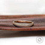 Front view of double row pave half eternity band