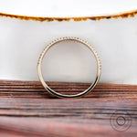 Side profile highlighting half eternity pave setting