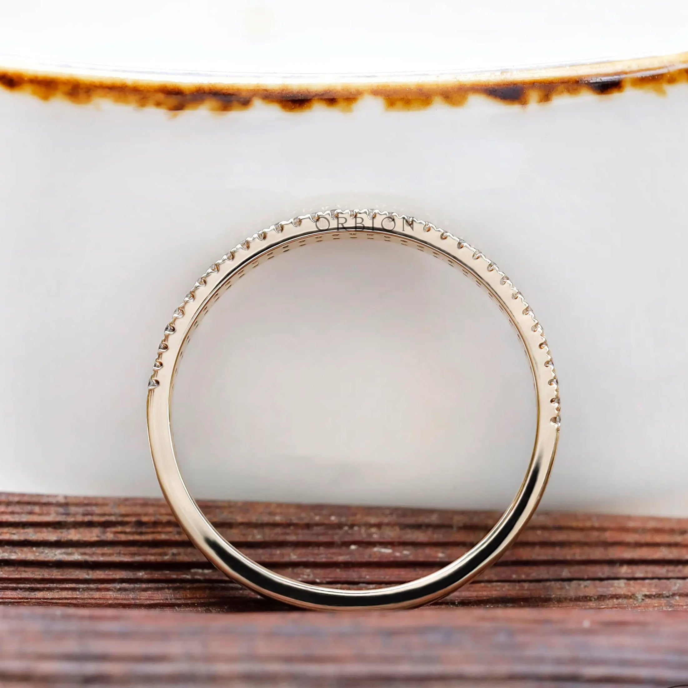 Side profile highlighting half eternity pave setting