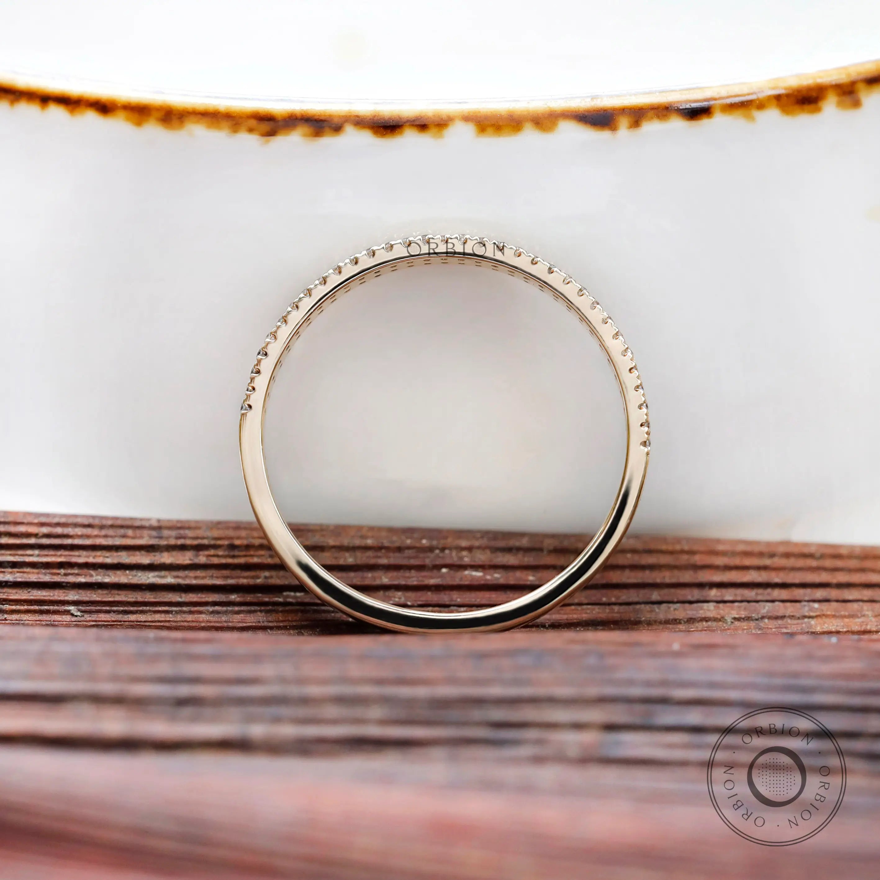 Side profile highlighting half eternity pave setting