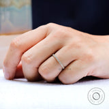 On hand view of minimalist pave wedding band