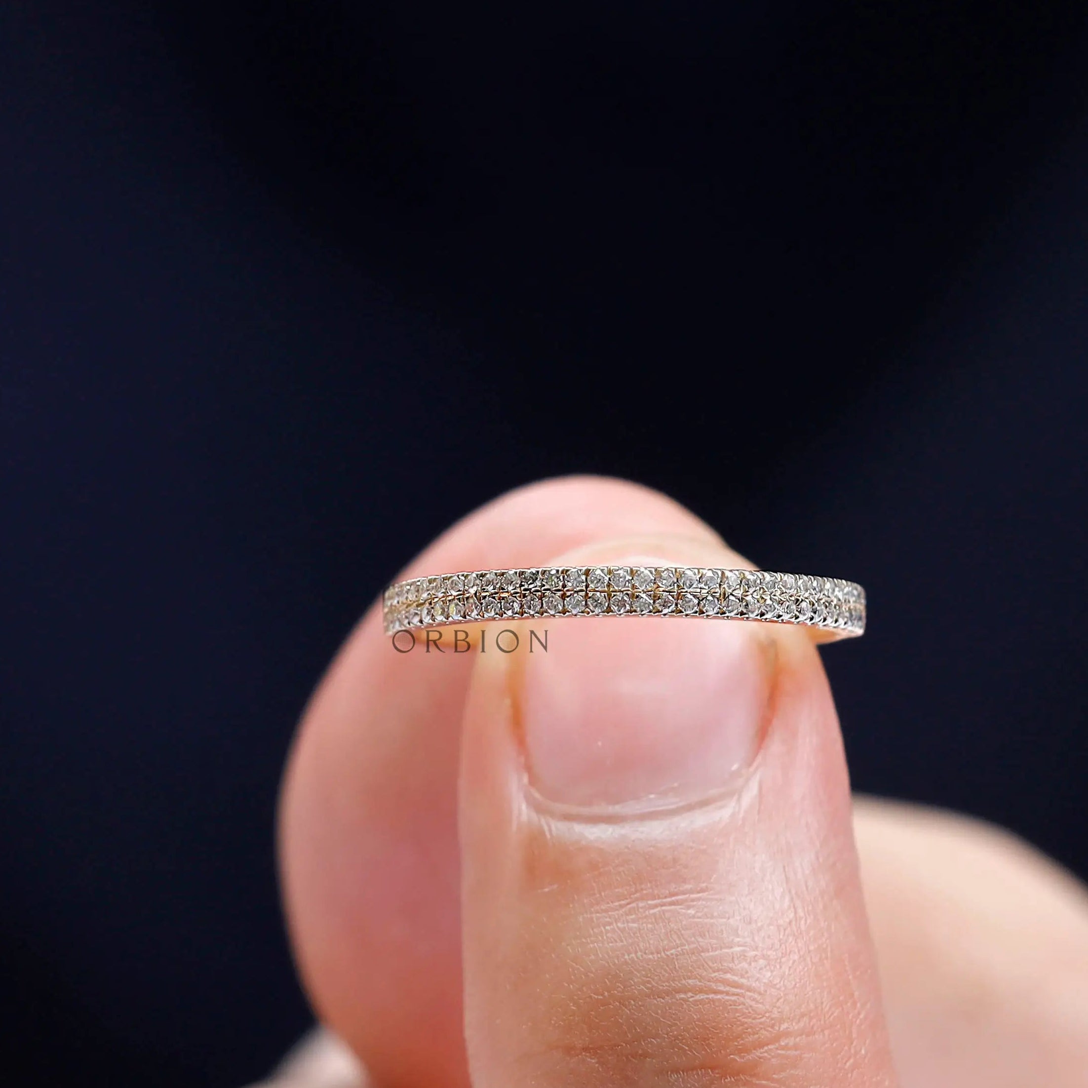 Close up of round pave moissanite stone detailing