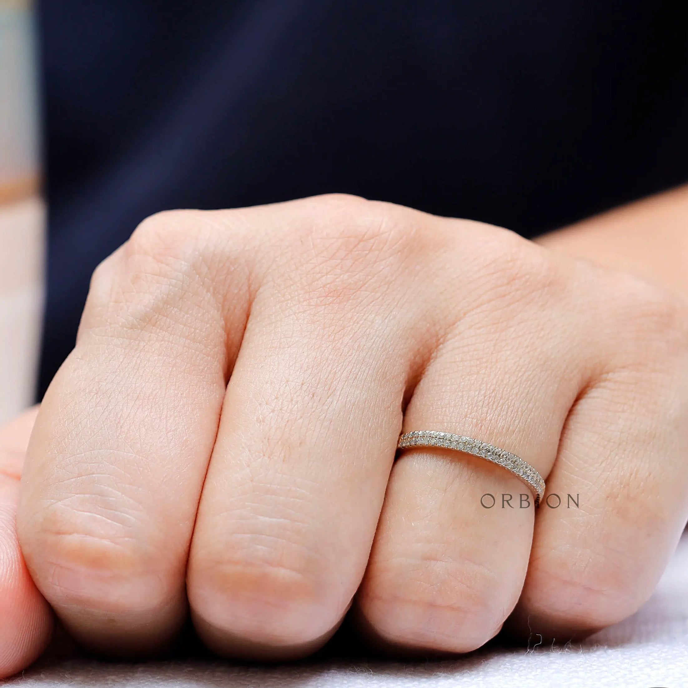 Lifestyle view of elegant double row pave band