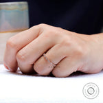 On-hand view showing delicate geometric band scale