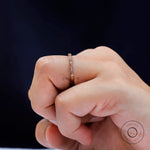 Side profile of geometric gold band worn on hand