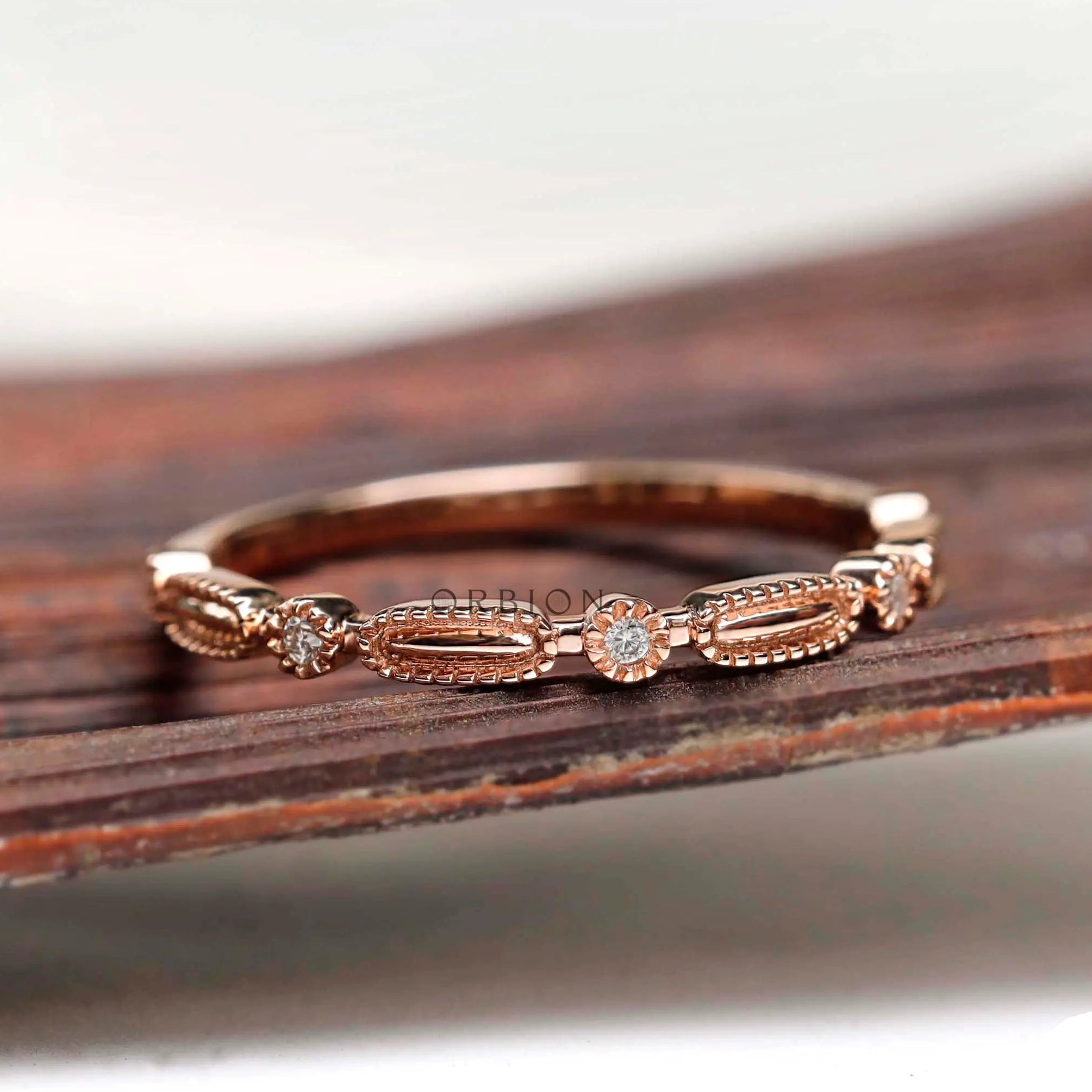 Angled view geometric textured band with round stone accents