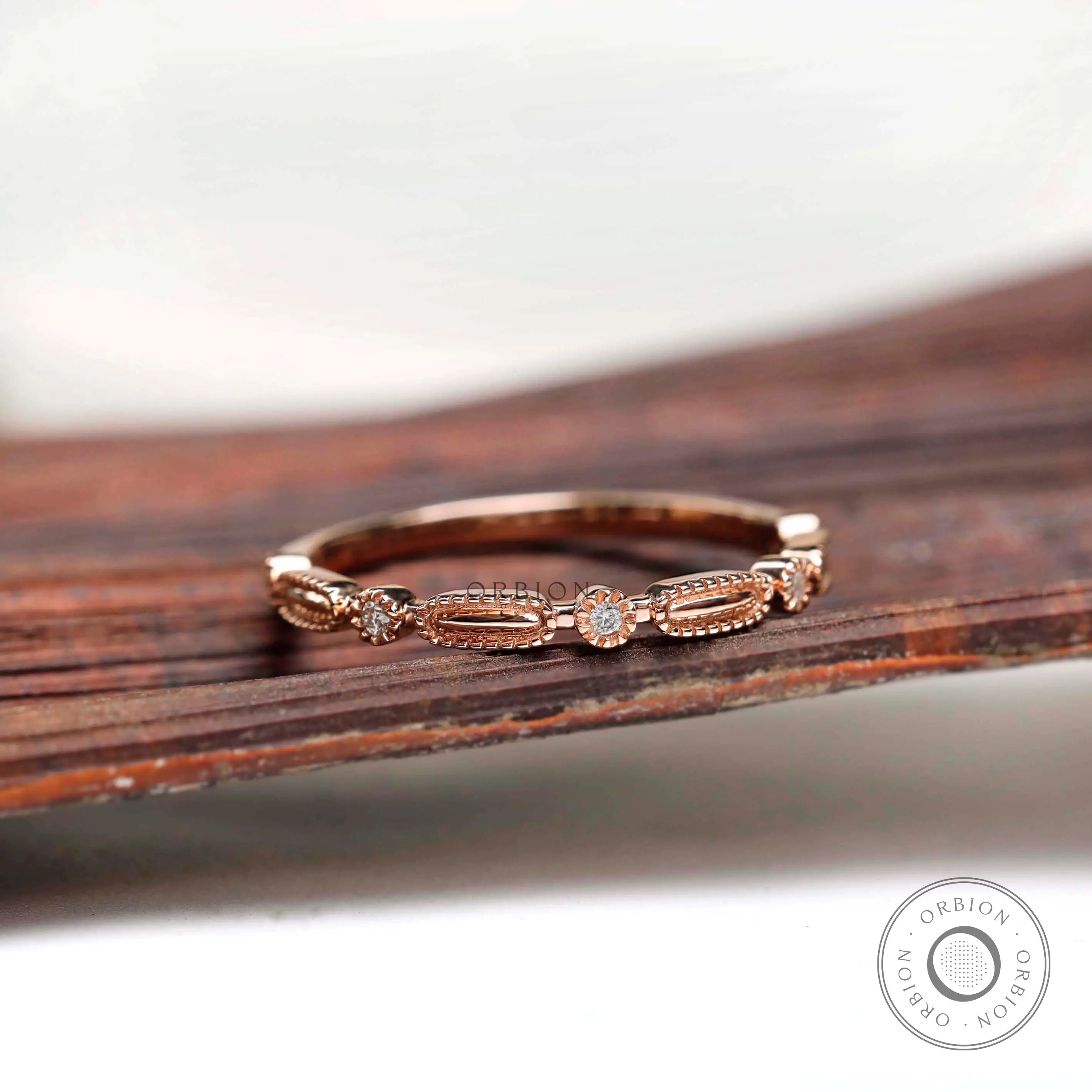 Angled view geometric textured band with round stone accents