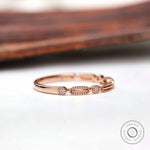 Side profile textured geometric wedding band with round stones