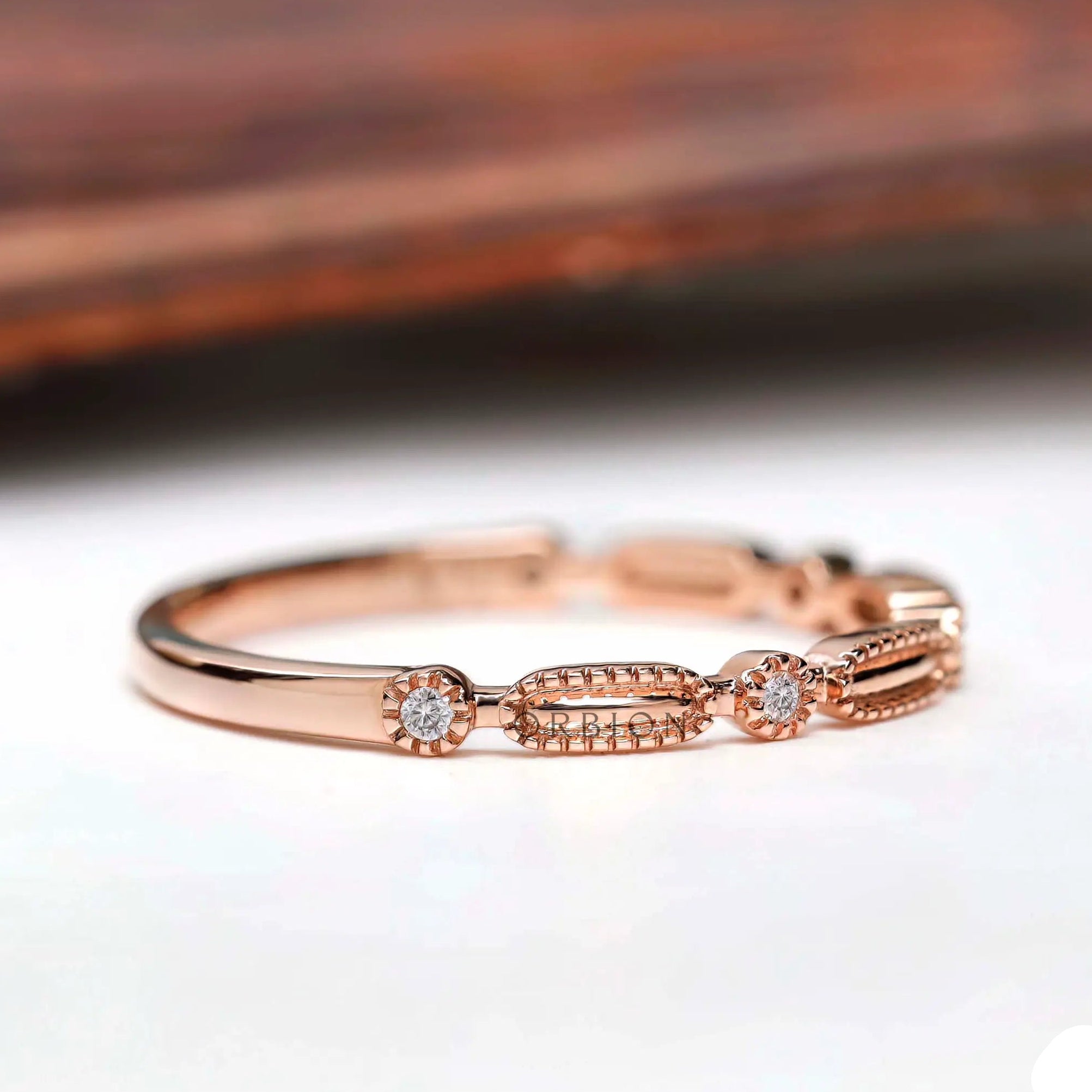 Side profile textured geometric wedding band with round stones