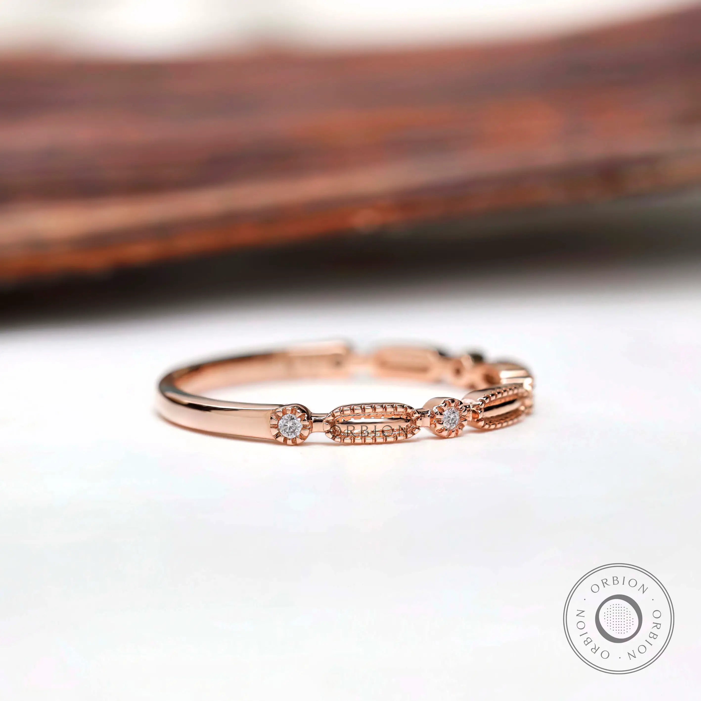 Side profile textured geometric wedding band with round stones
