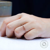 Top view geometric textured wedding band with round stone accents