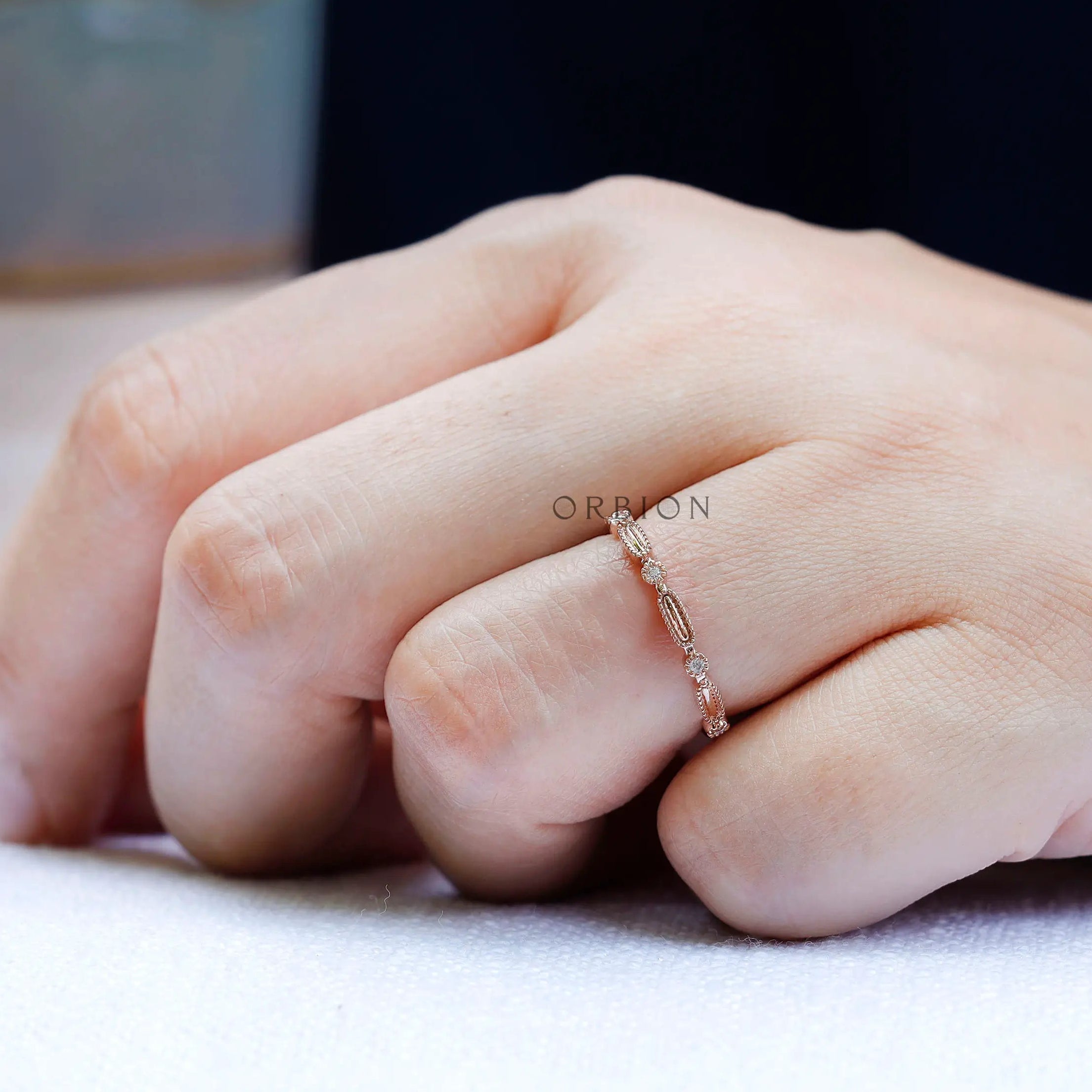 Top view geometric textured wedding band with round stone accents