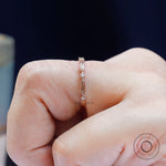 Macro detail geometric texture and round stone accents on band