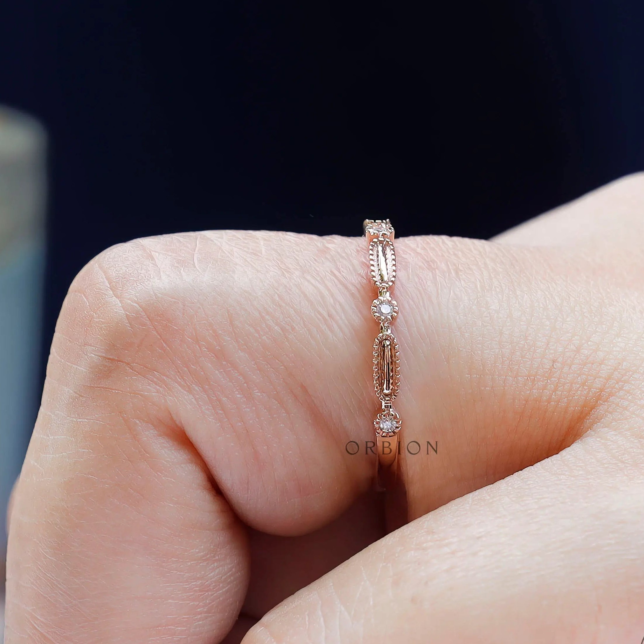 Macro detail geometric texture and round stone accents on band