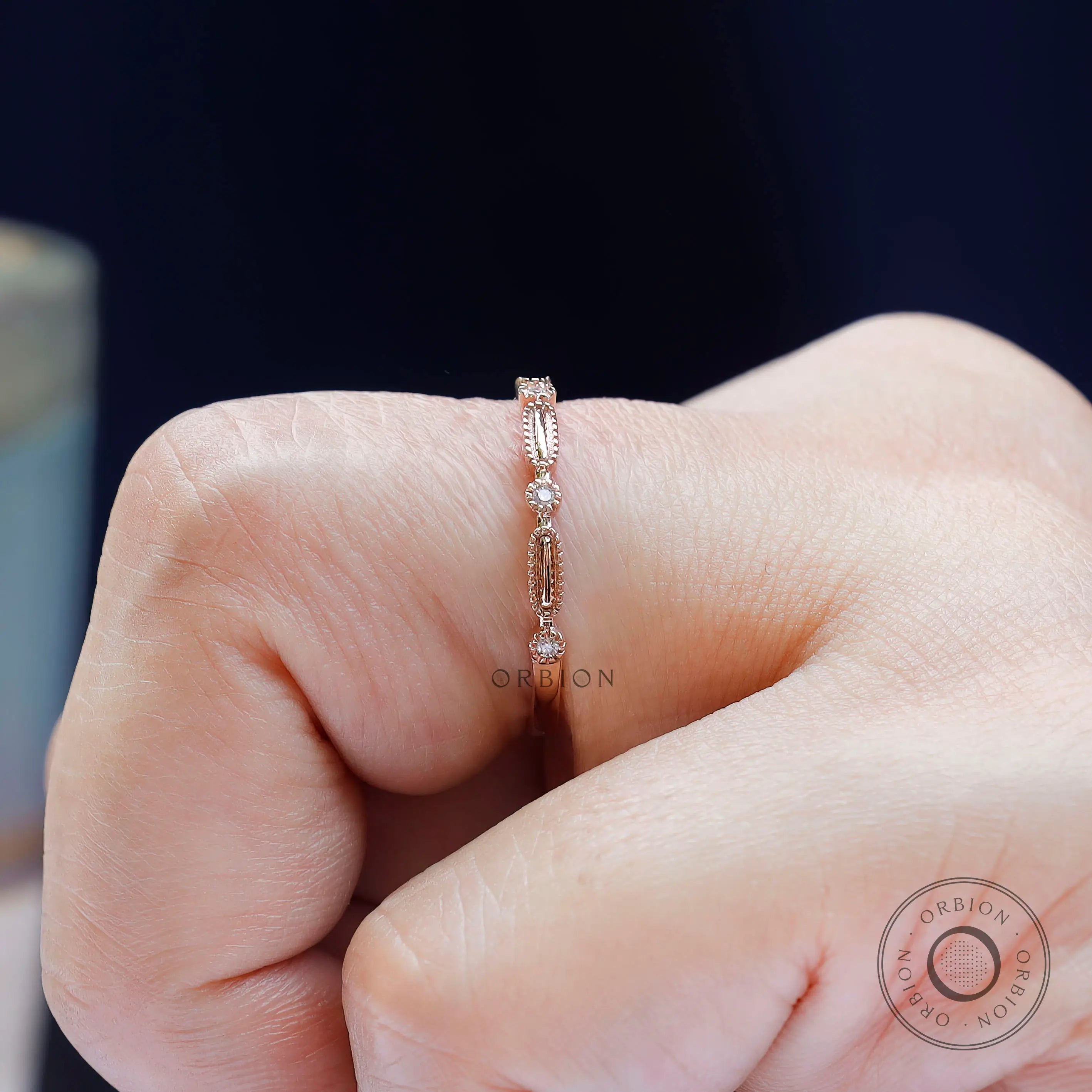 Macro detail geometric texture and round stone accents on band