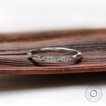 Front view geometric moissanite halfway wedding band