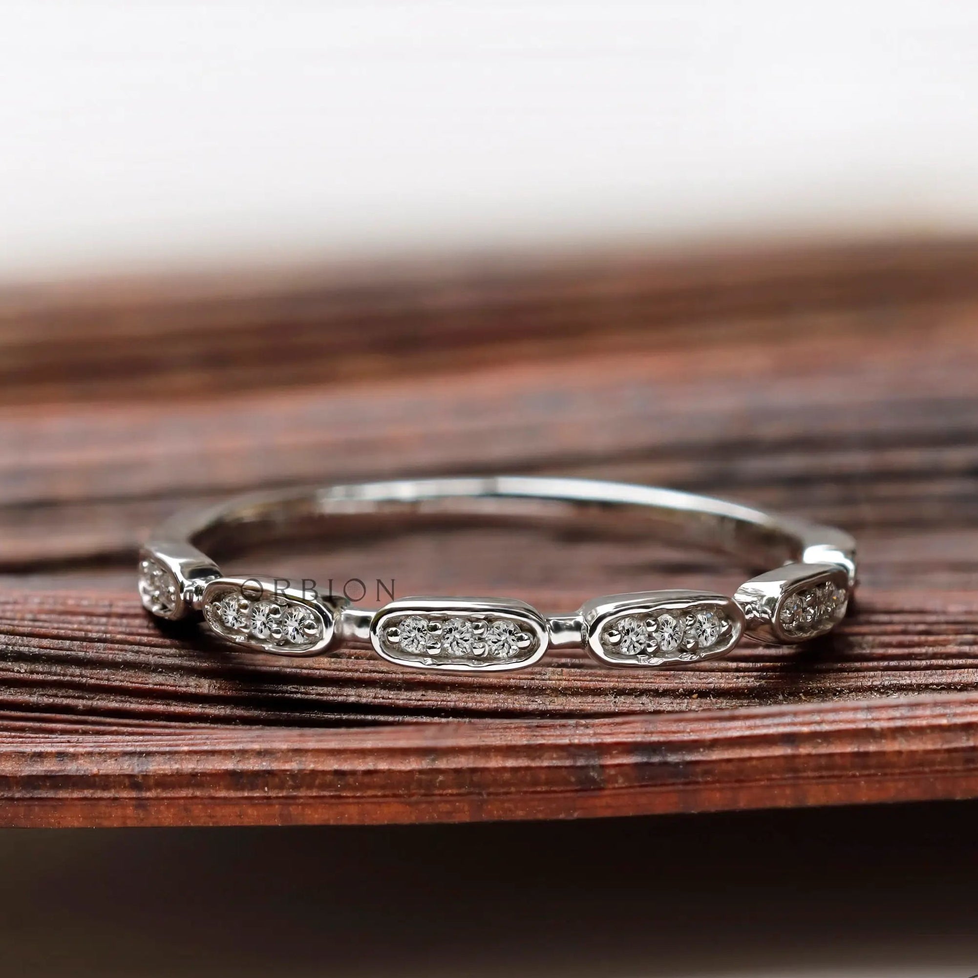 Front view geometric moissanite halfway wedding band