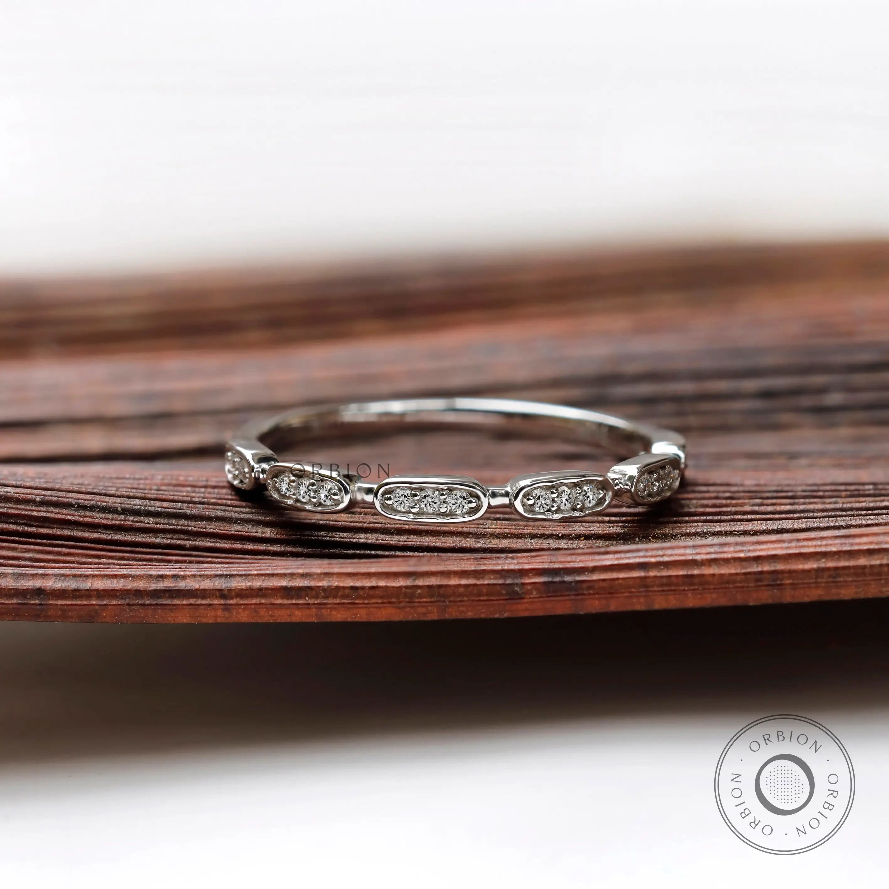 Front view geometric moissanite halfway wedding band