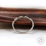 Side profile showing structured geometric gold band