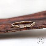Front view of Art Deco diamond yellow gold on wooden prop