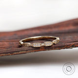 Front view of Art Deco diamond yellow gold on wooden prop