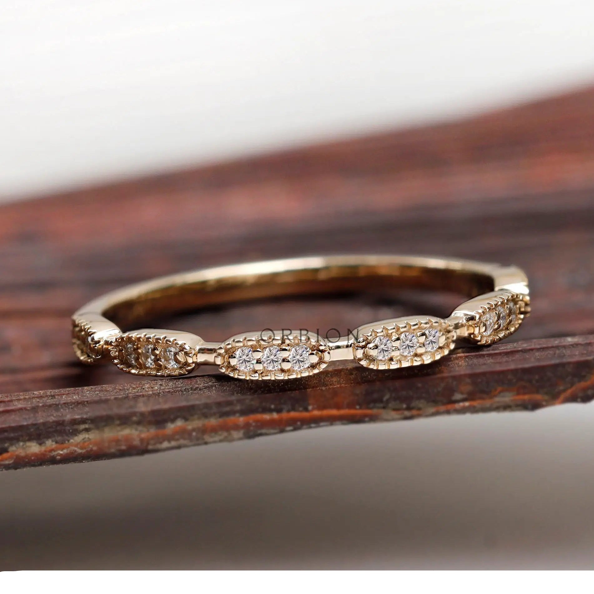 Front view of Art Deco diamond yellow gold on wooden prop