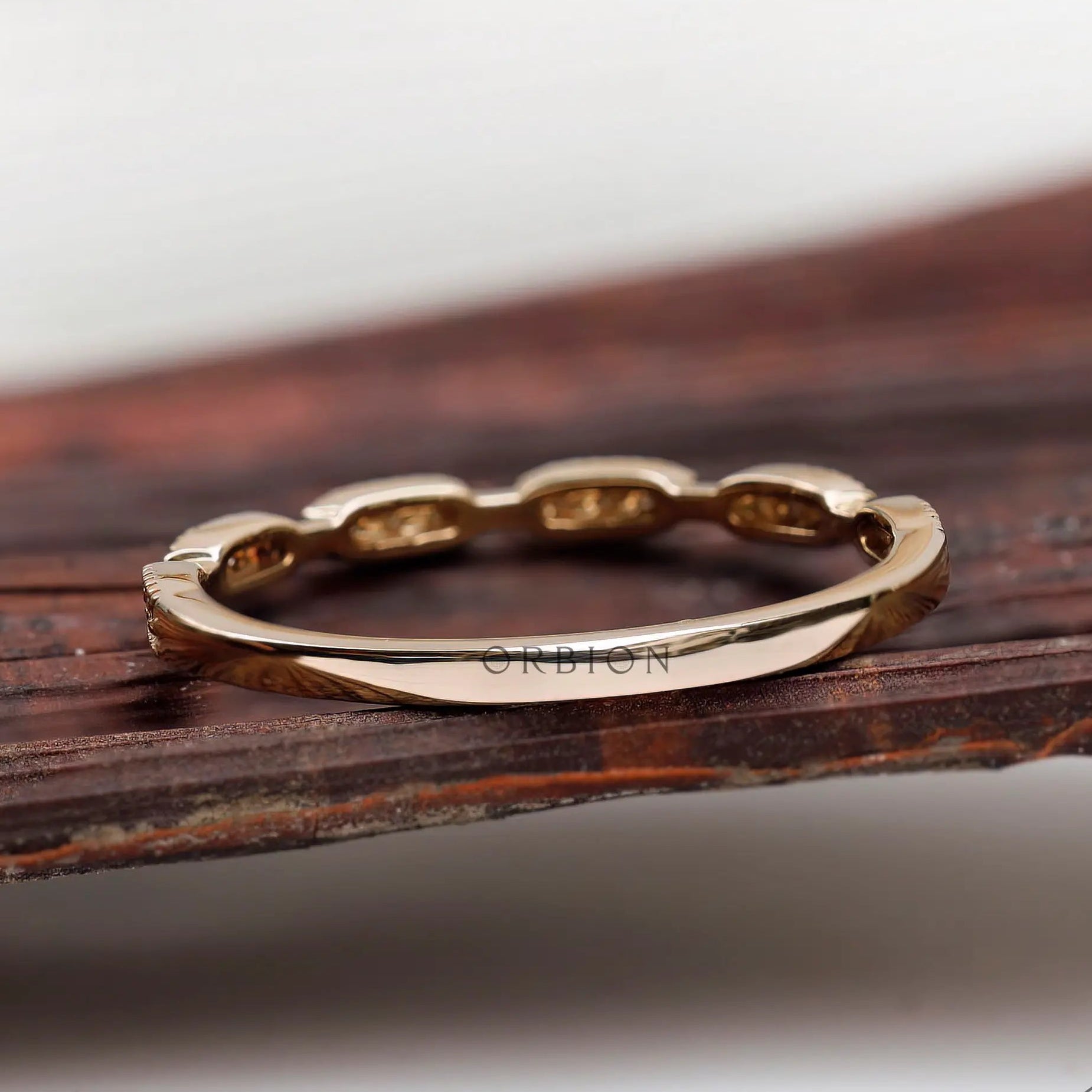 Back profile view of the gold band showing smooth shank