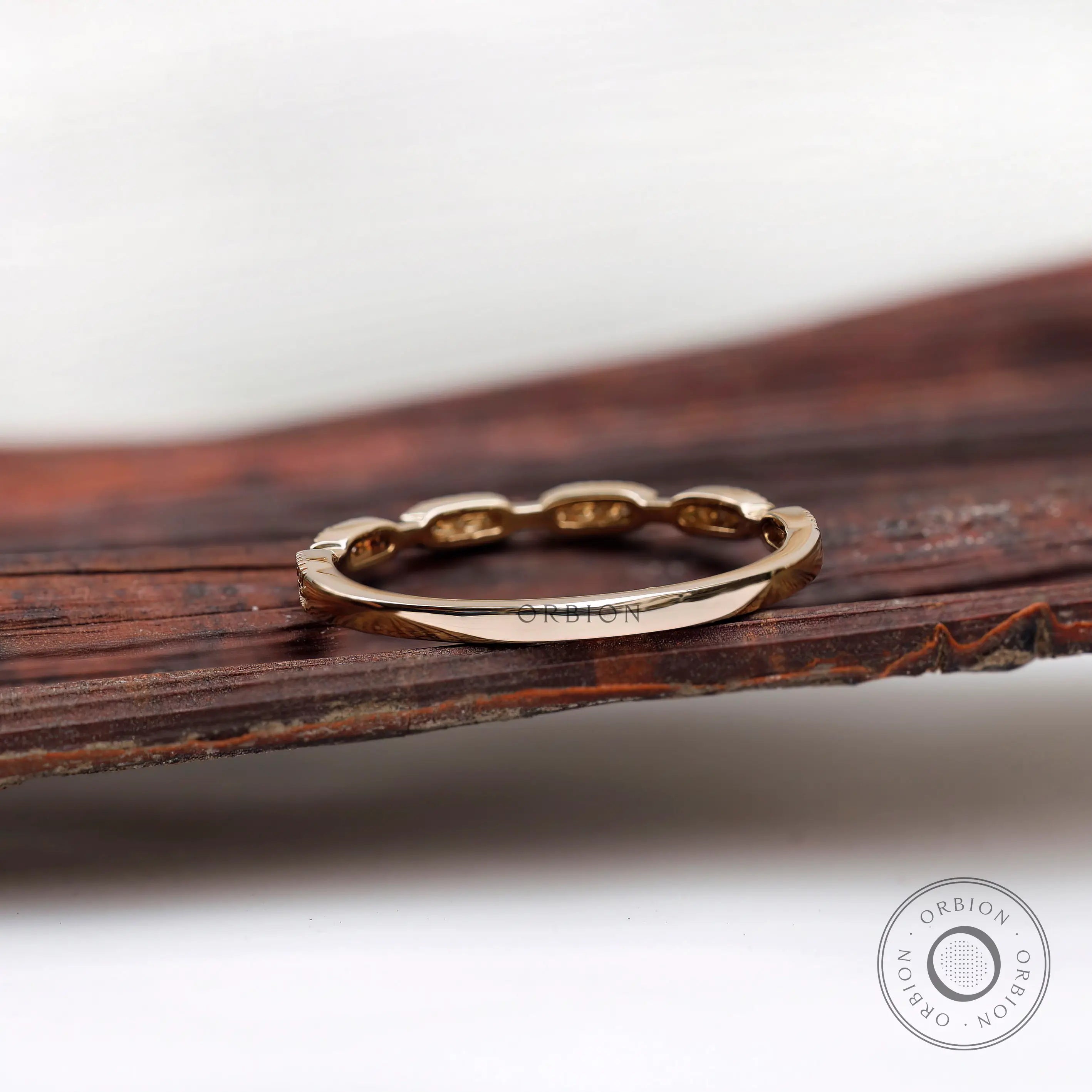 Back profile view of the gold band showing smooth shank