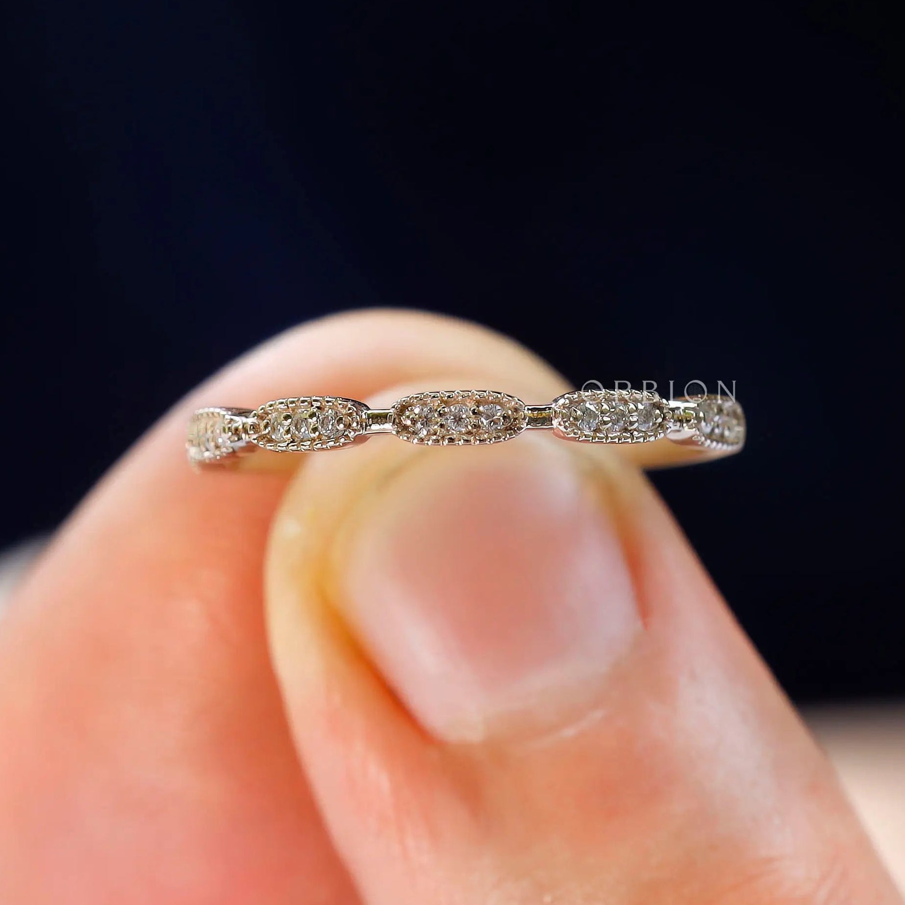 Close-up view of the Art Deco and milgrain edges on the gold band