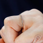 Side on-hand close-up details on the yellow gold wedding band