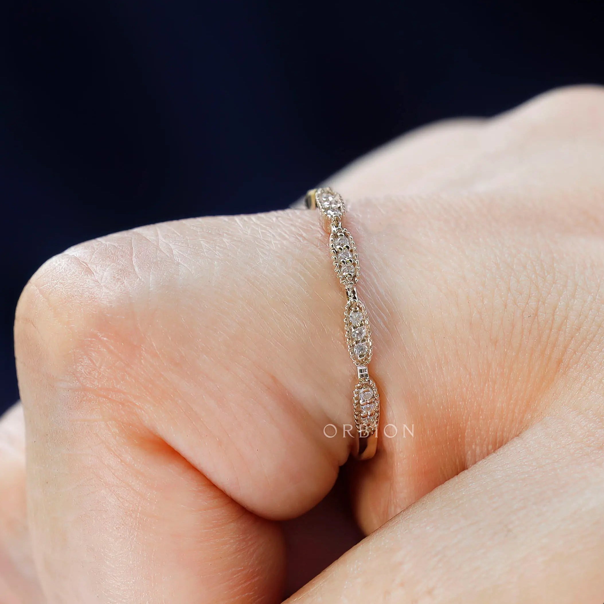 Side on-hand close-up details on the yellow gold wedding band