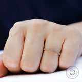 Worn view showing delicate Art Deco inspired, stackable gold band