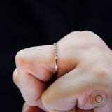 Side profile on hand displaying floating bubble stone setting design.