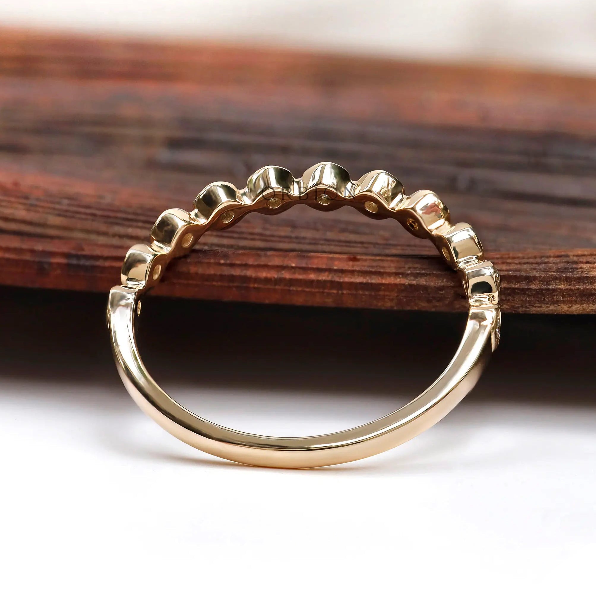 Angled View Highlighting Bubble Moissanite Eternity Design