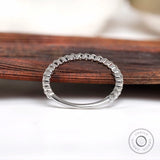 Floating bubble moissanite eternity band showing full circle prong setting