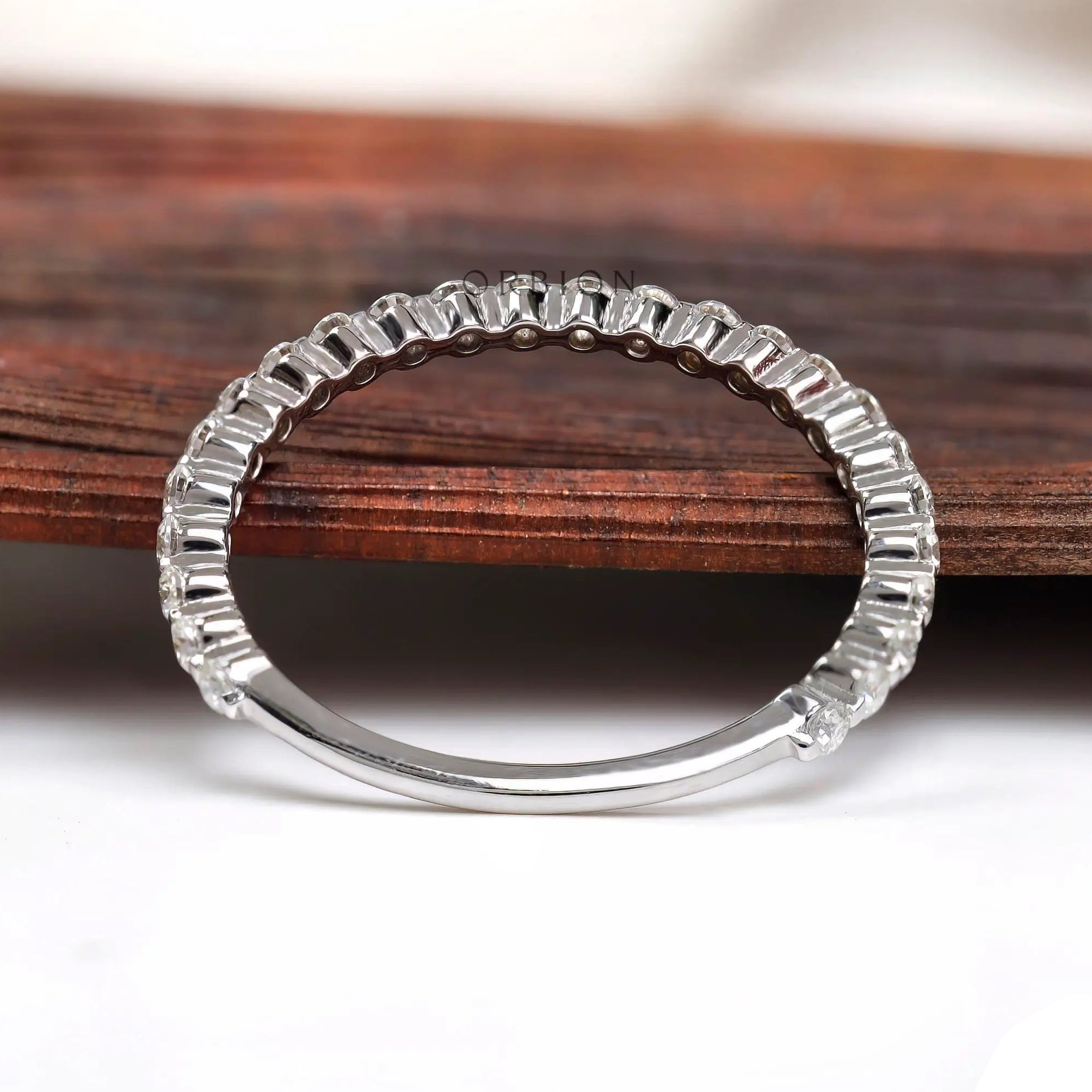 Floating bubble moissanite eternity band showing full circle prong setting