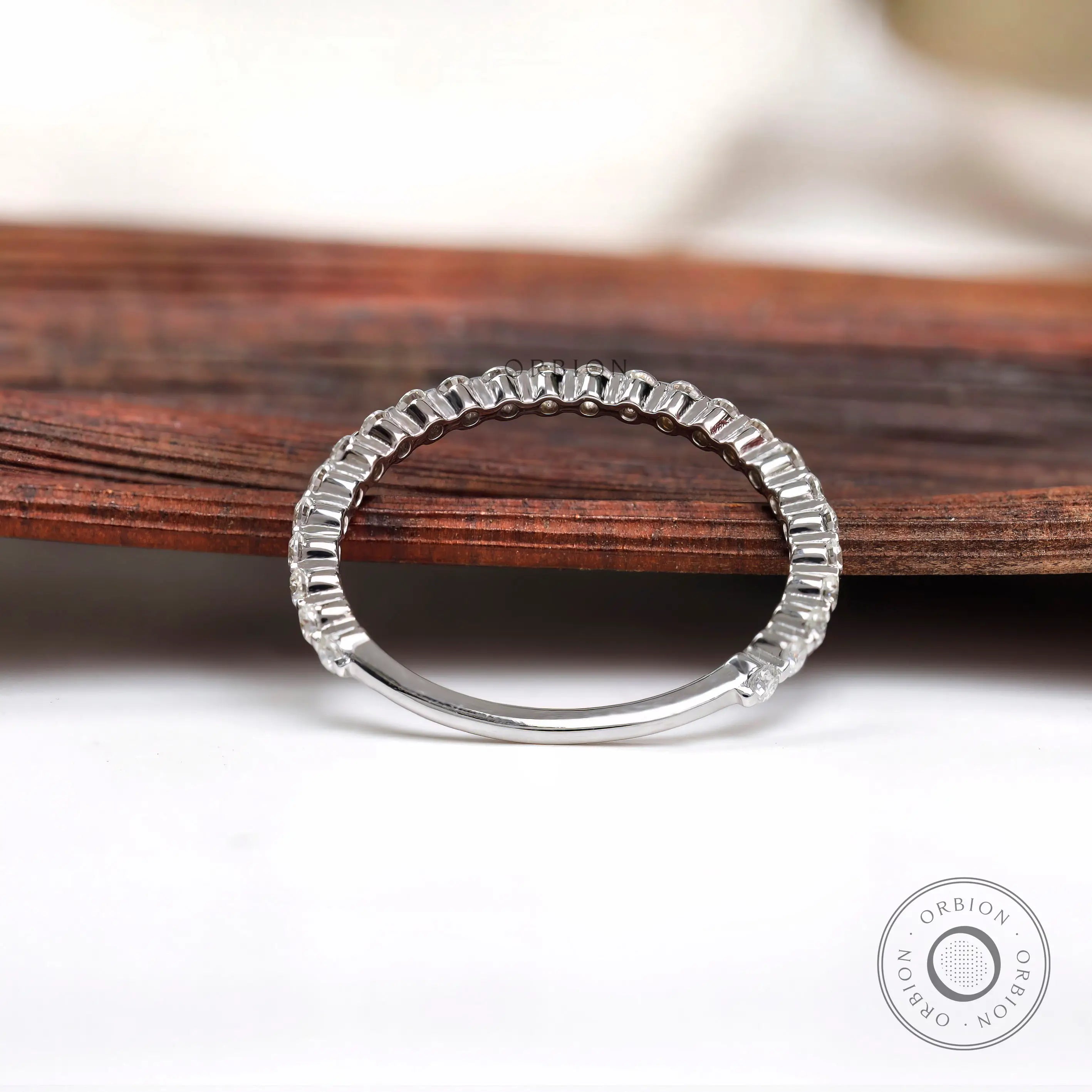 Floating bubble moissanite eternity band showing full circle prong setting