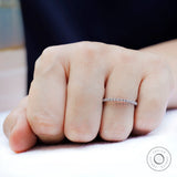 Round moissanite bubble eternity band worn on hand, minimalist stacking ring look