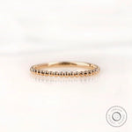 Front view of beaded ball gold dainty wedding band in yellow gold