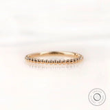 Front view of beaded ball gold dainty wedding band in yellow gold