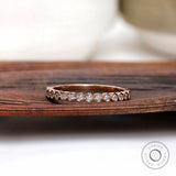Bezel set round moissanite half eternity band front view