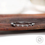 Minimalist floating bubble round half eternity band in white gold, front view