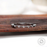 Minimalist floating bubble round half eternity band in white gold, front view