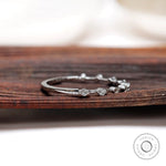 Floating bubble single prong round band in white gold, angled sparkle view