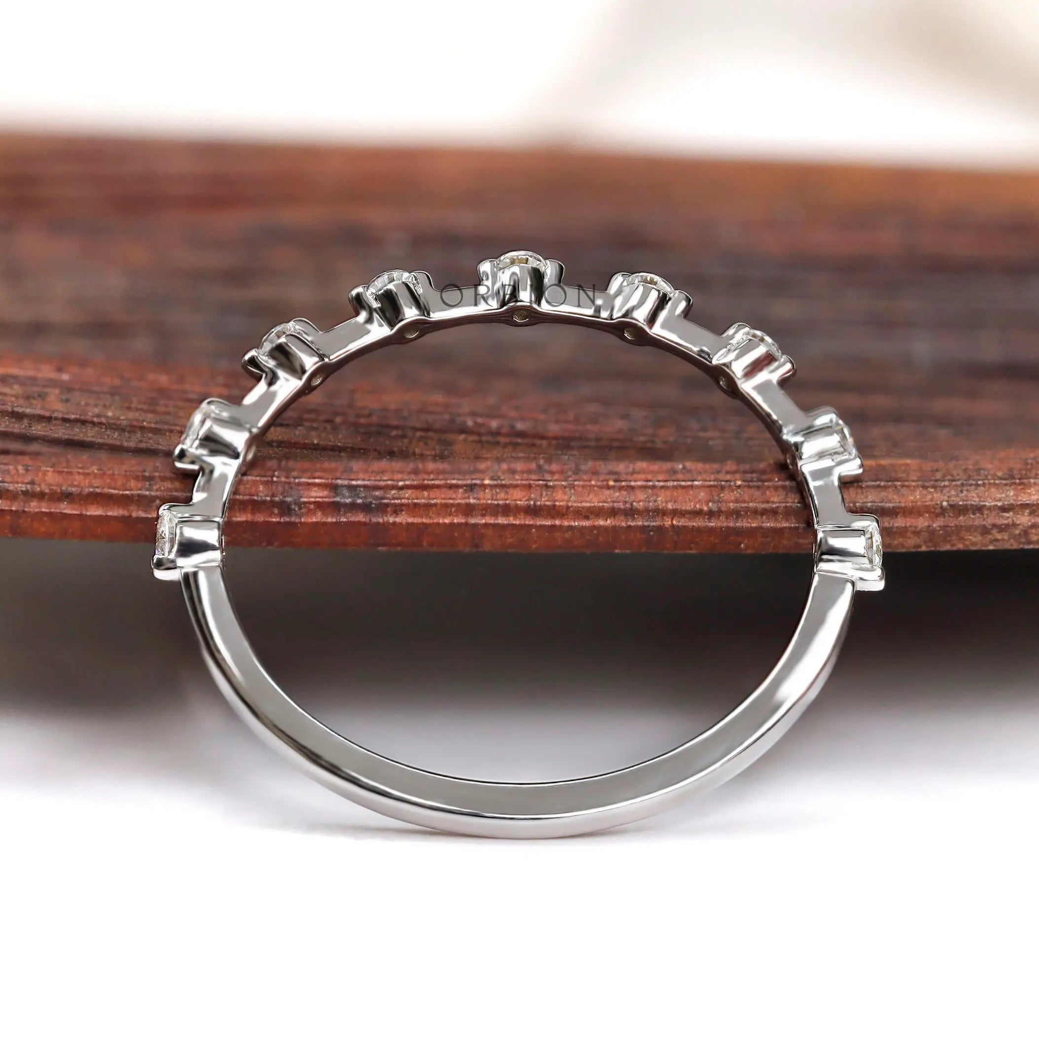 Back view of bubble set round half eternity band in white gold