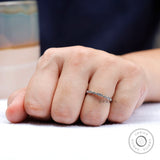 Minimal geometric moissanite stacking band worn on hand lifestyle view